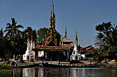 Inle Lake Myanmar. All the buildings are constructed on piles. Residents travel around by canoe, but there are also bamboo walkways and bridges over the canals, monasteries and stupas. 